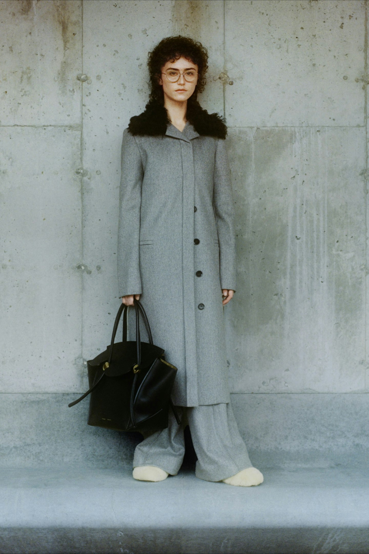 Ella Emhoff wearing a grey coat and cream shoes for Proenza Schouler