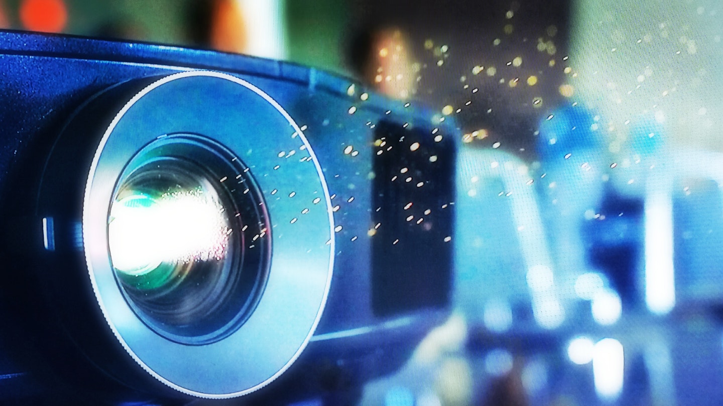 Close-up of a budget projector lens