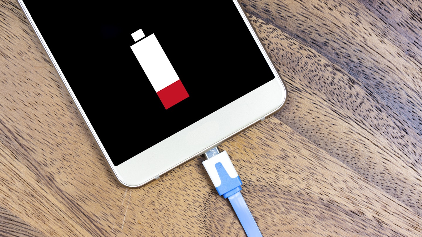 A lightning cable being plugged into a smartphone