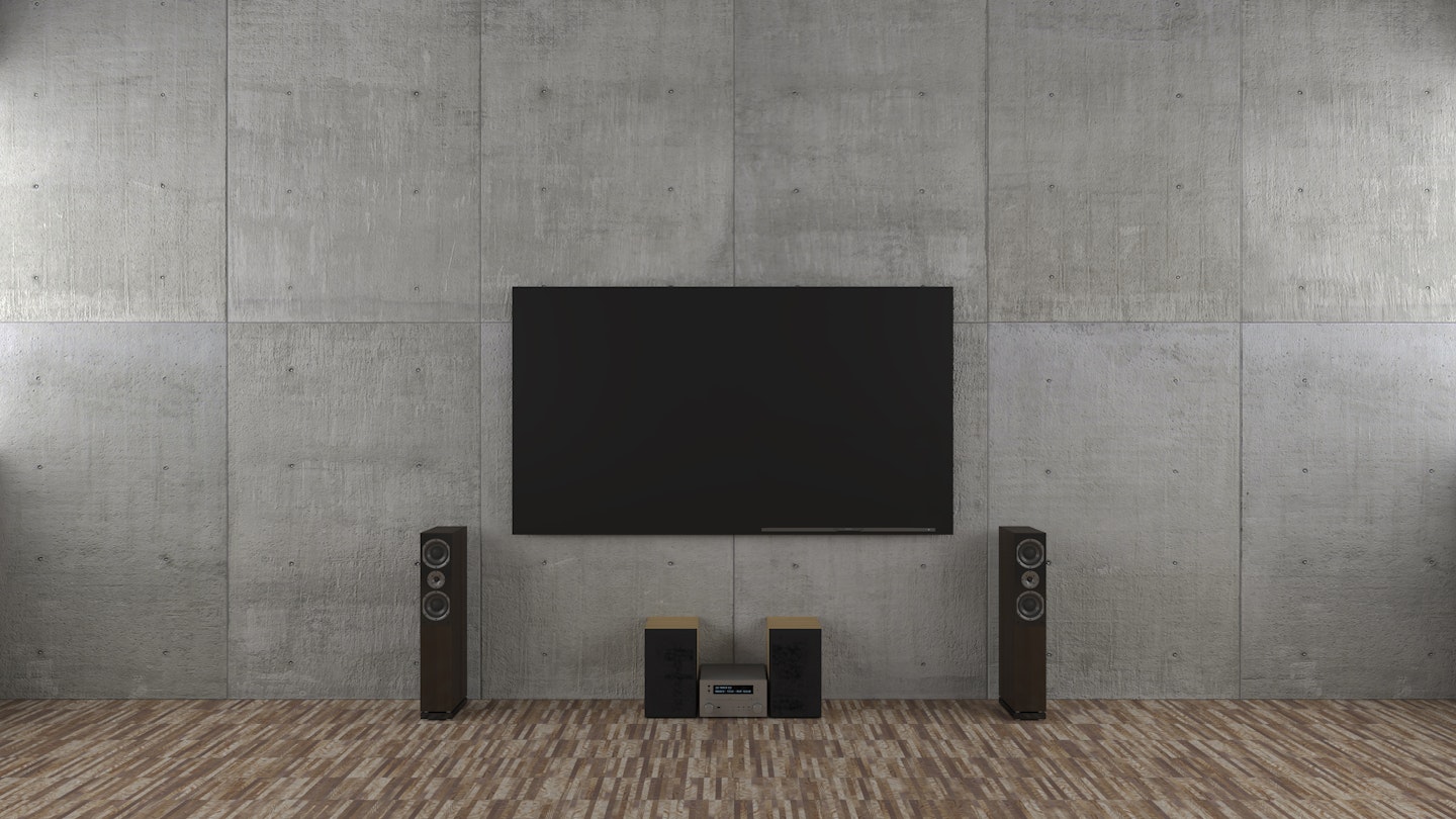A large flat screen TV mounted to a wall.
