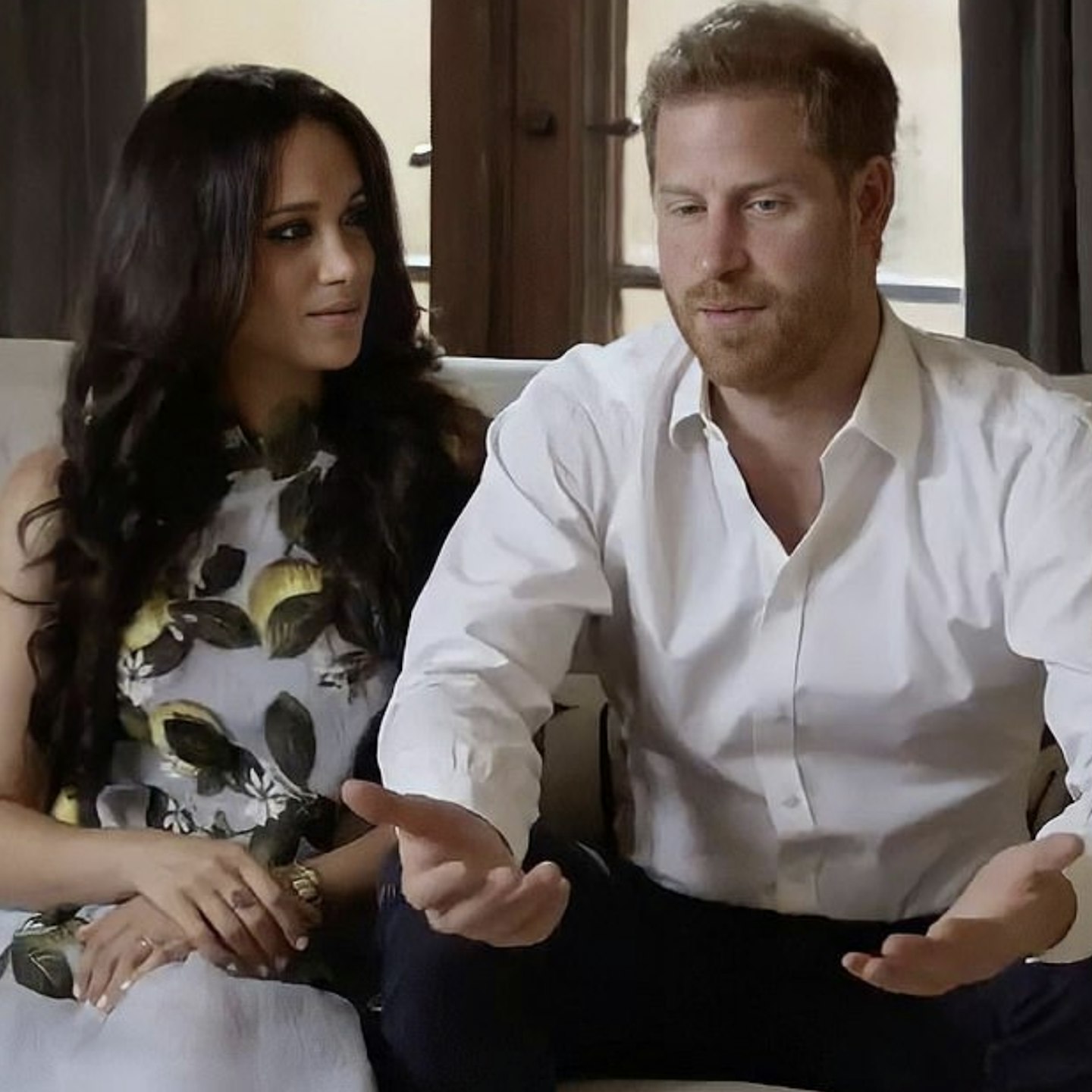 Meghan Markle wears flowery dress and sits next to Prince Harry