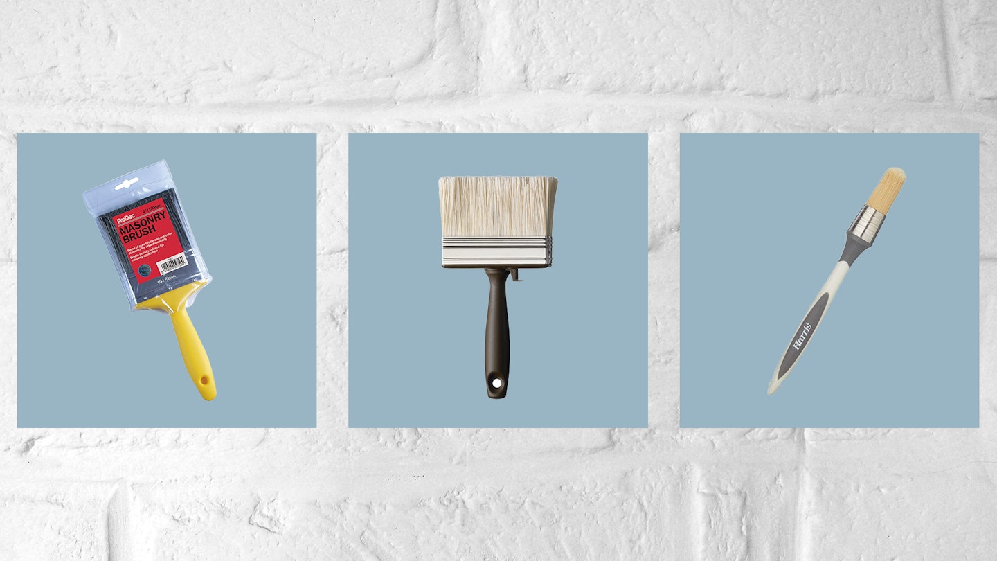 Three of the best paint brushes in blue frames against a painted white wall