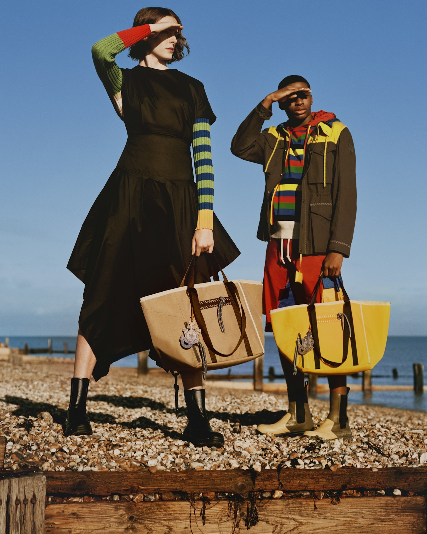 Models wearing striped jumpers at the seaside 