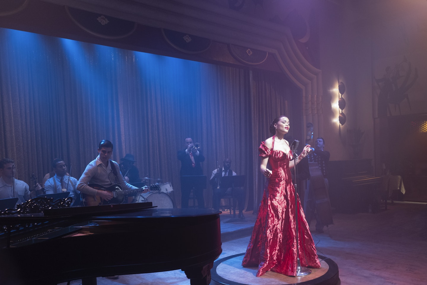 Andra Day wearing a red halter neck dress in The United States Vs Billie Holiday