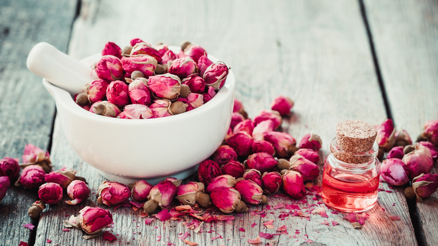 Rose essential oil and rose buds 