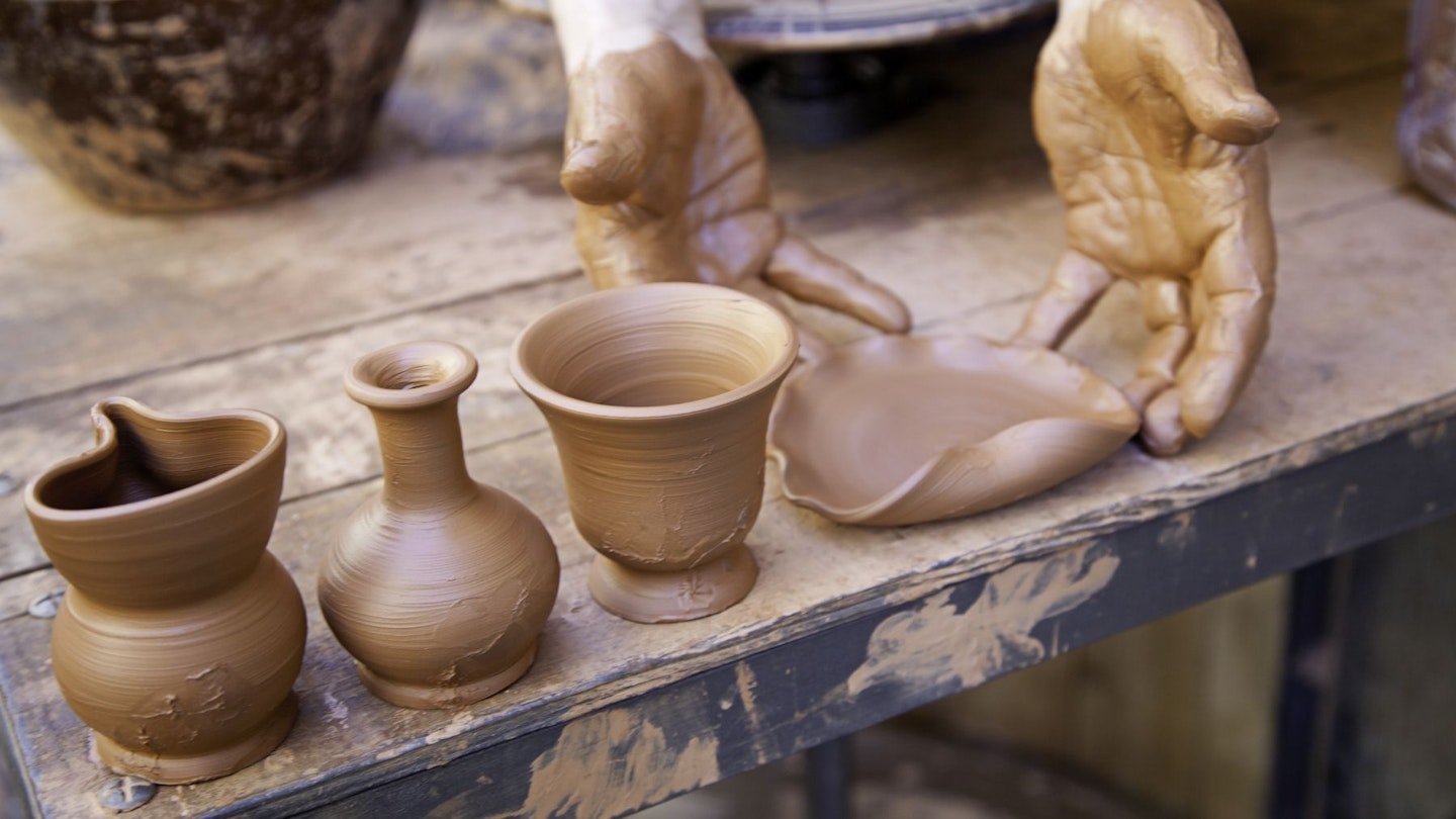 Hands moulding pottery sculptures
