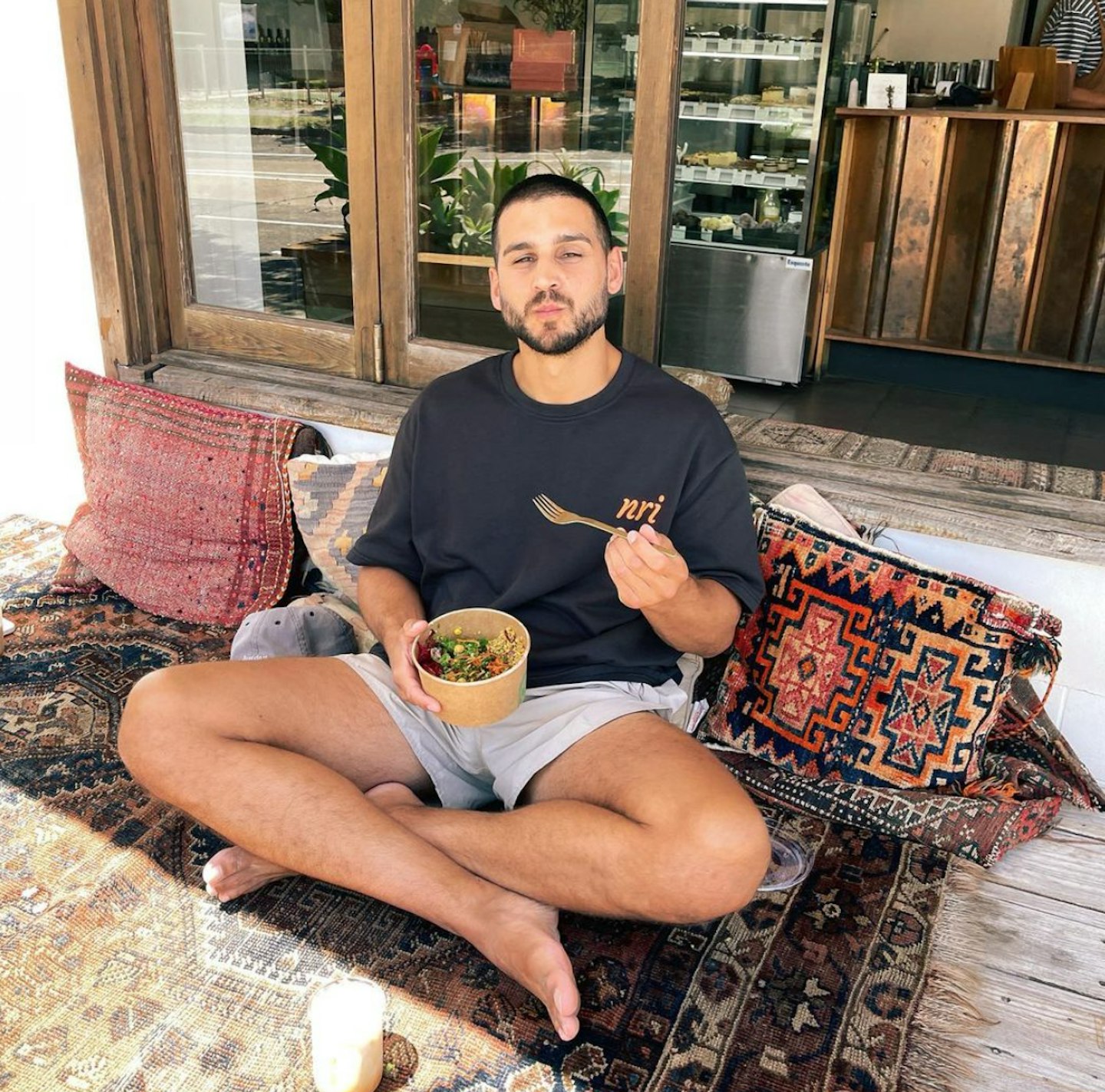 Michael Brunelli poses for instagram post with salad bowl promoting healthy lifestyle