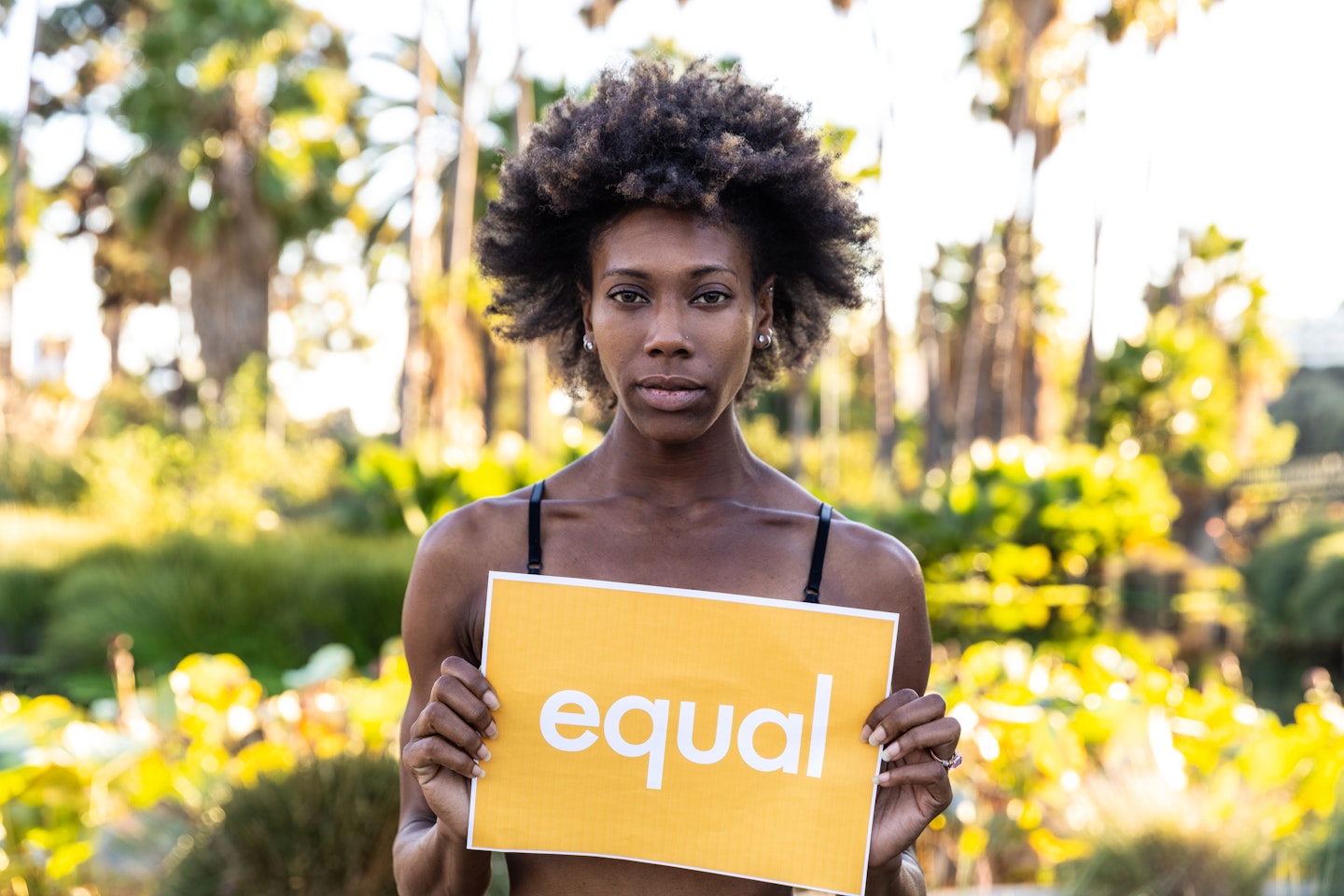 Woman holding an equal sign