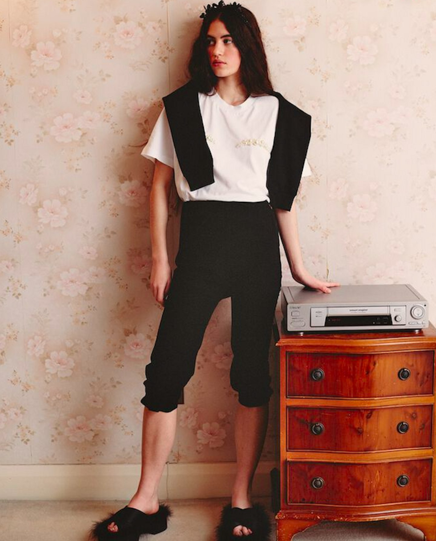 Model wearing fluffy platform sandals and a white tee from Simone Rocha x H&M