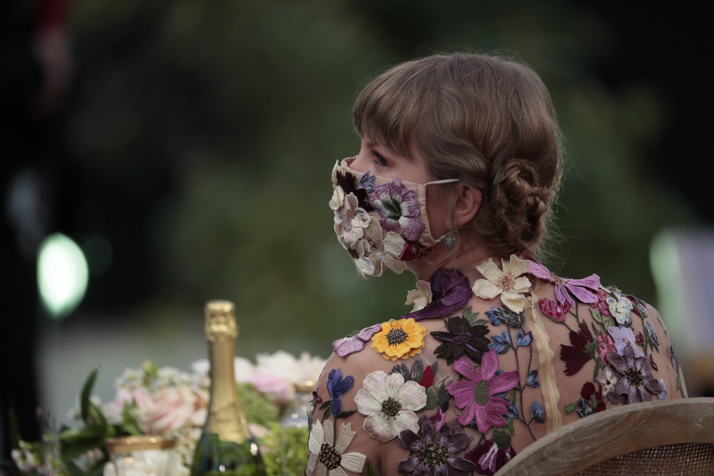 Taylor Swift wearing a floral face covering at the Grammy Awards 2021