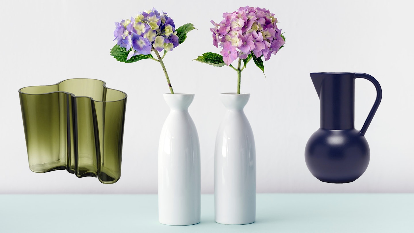 Two product vases perched either side of a generic vase ensemble  