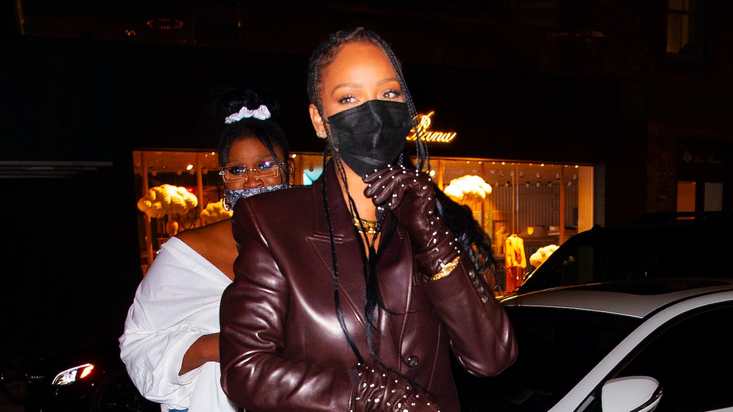 Rihanna wearing a chocolate brown leather blazer while out in New York