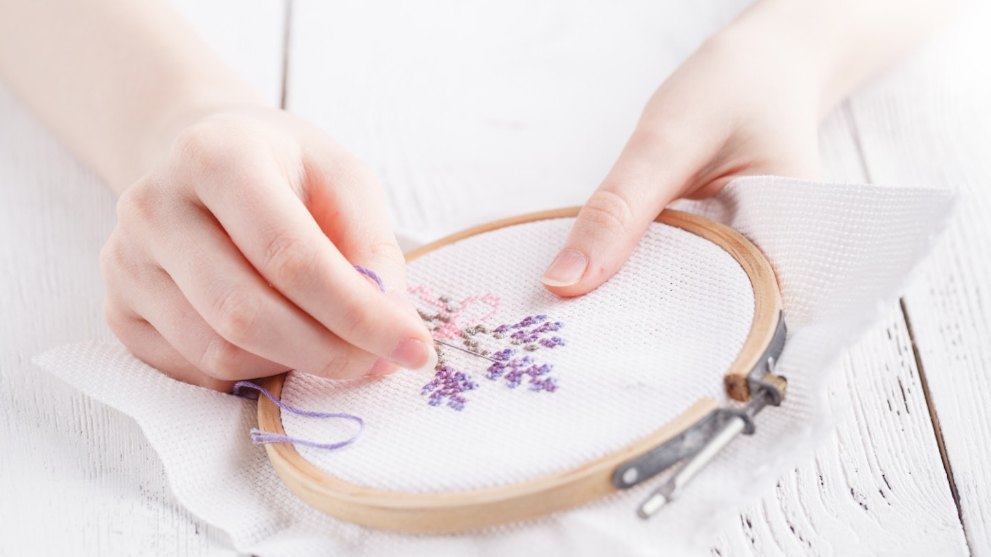 Woman using the best fabric for embroidery 