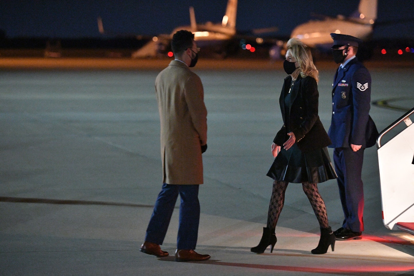 Dr Jill Biden stepping off an airplane wearing patterned tights