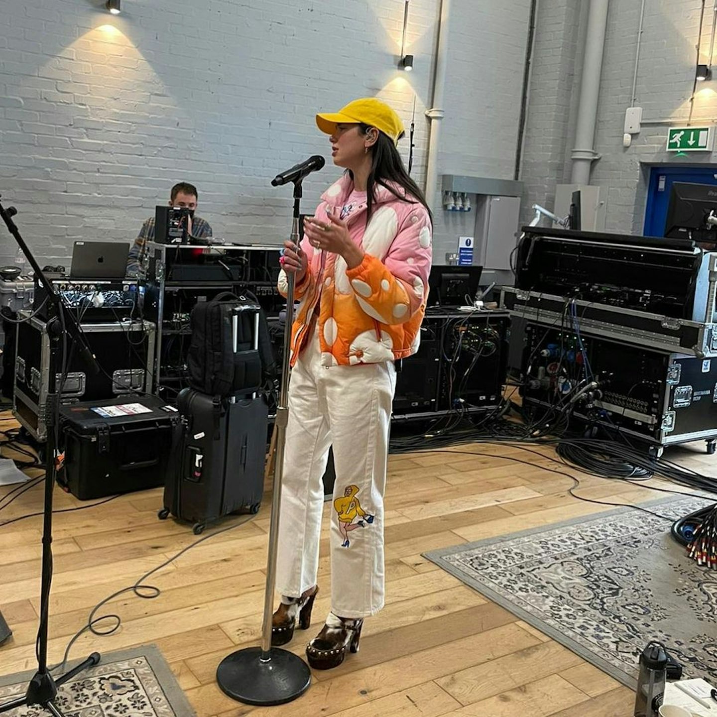 Dua Lipa wearing clogs in a recording studio