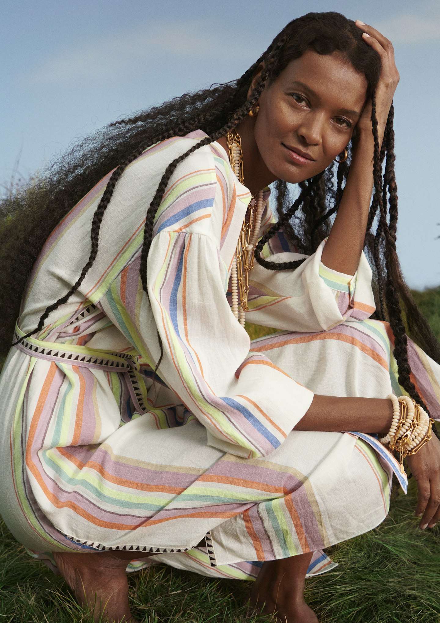 Liya Kebede wearing a striped dress from her collection with H&M