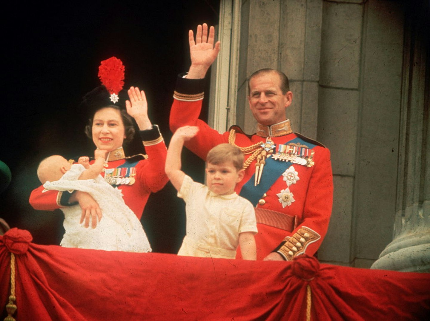 Queen Elizabeth, Prince Philip, Prince Andrew and Prince Edward waving to the crowds from the balcony at Buckingham Palace