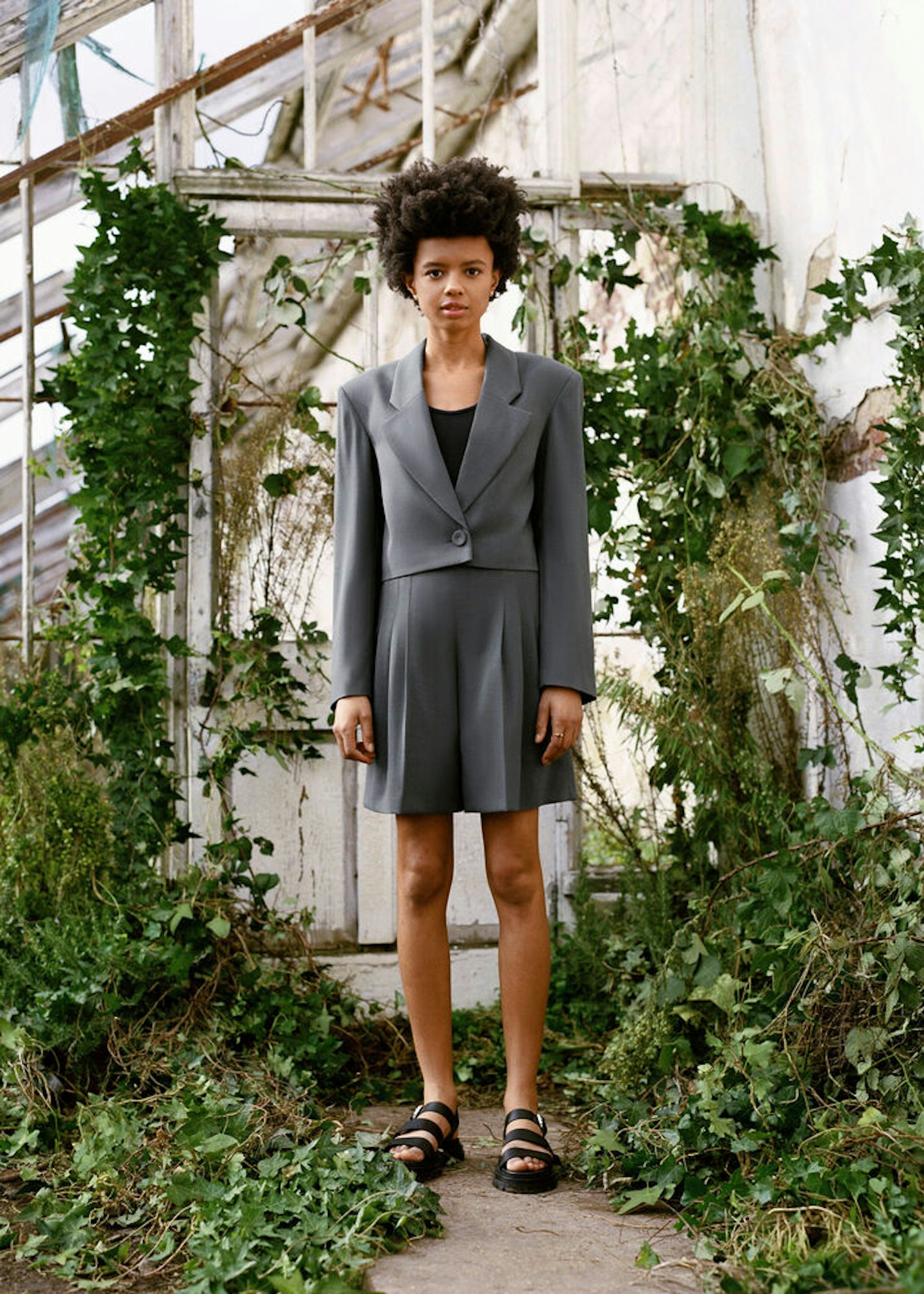 A model wearing a grey short suit from Rejina Pyo x & Other Stories