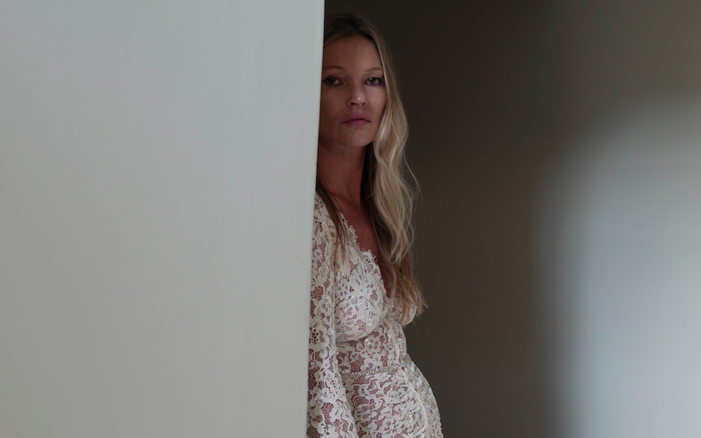 Kate Moss wearing a white lace dress from Self-Portrait