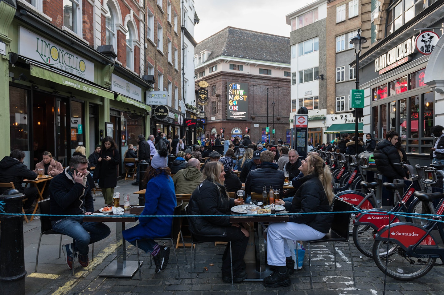 People eating out in a reopened Soho, London
