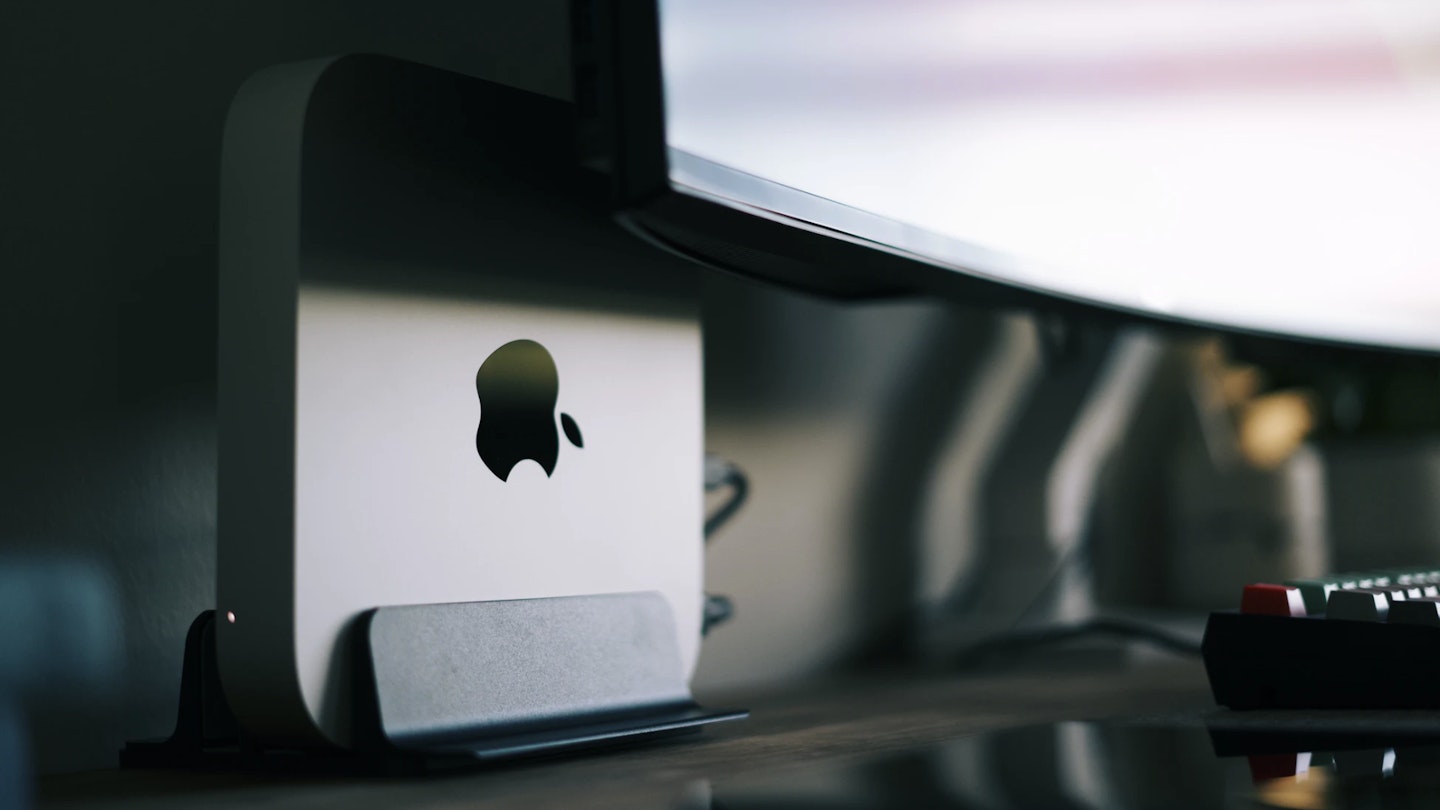 Apple Mac mini tucked behind monitor