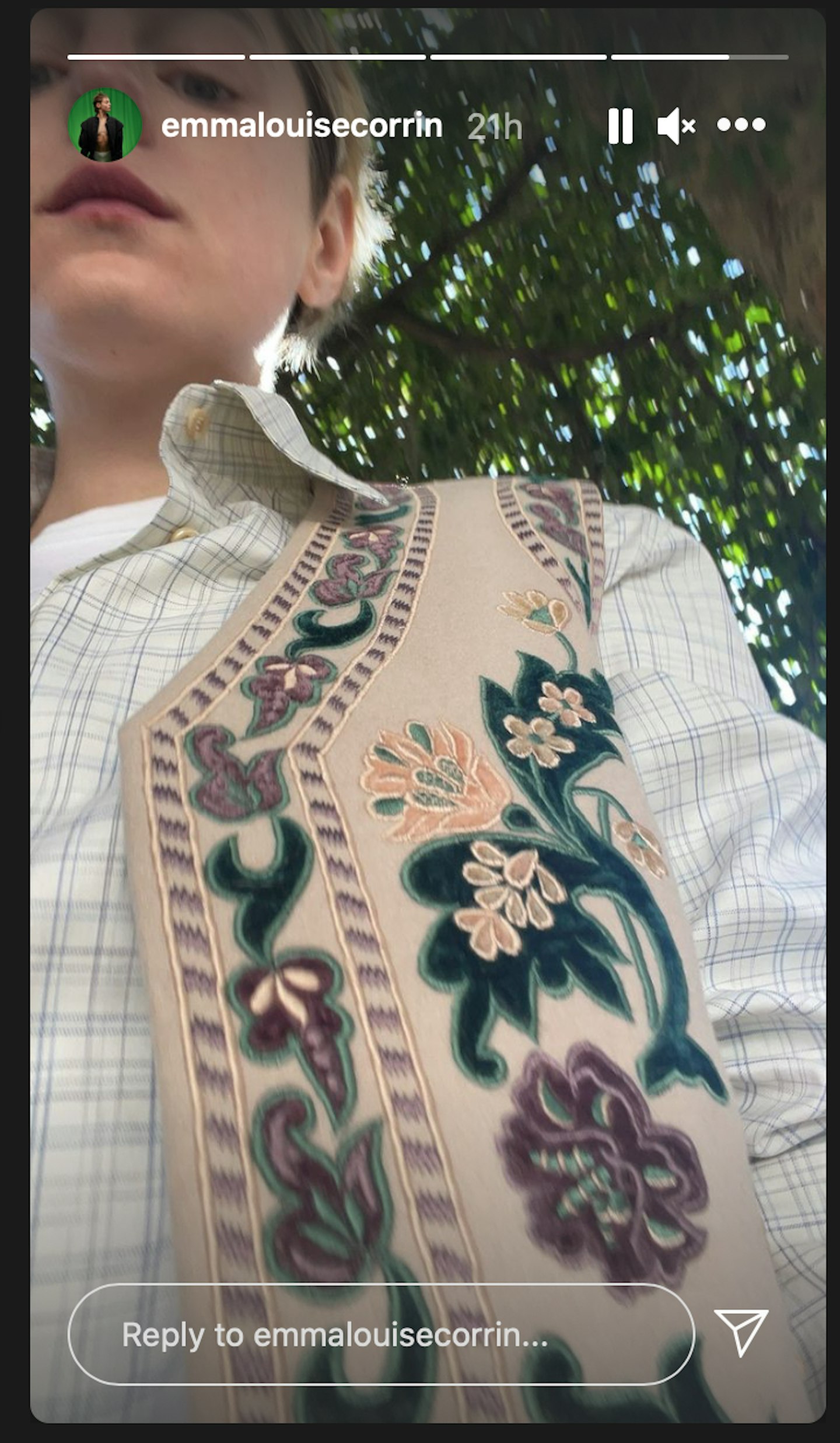 Emma Corrin wearing a floral waistcoat and checked shirt