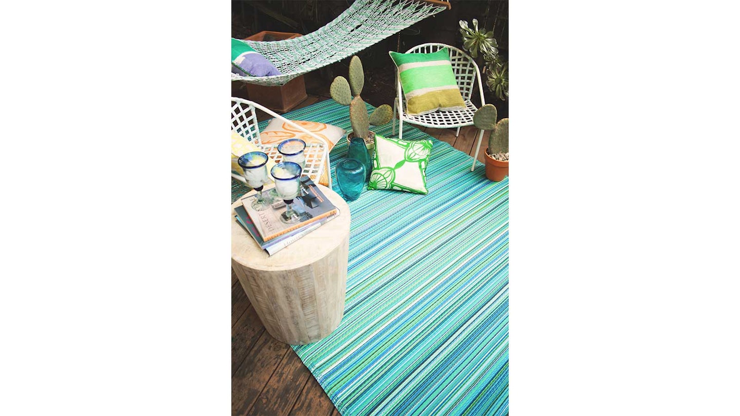 blue stripe outdoor rug in patio with hammock