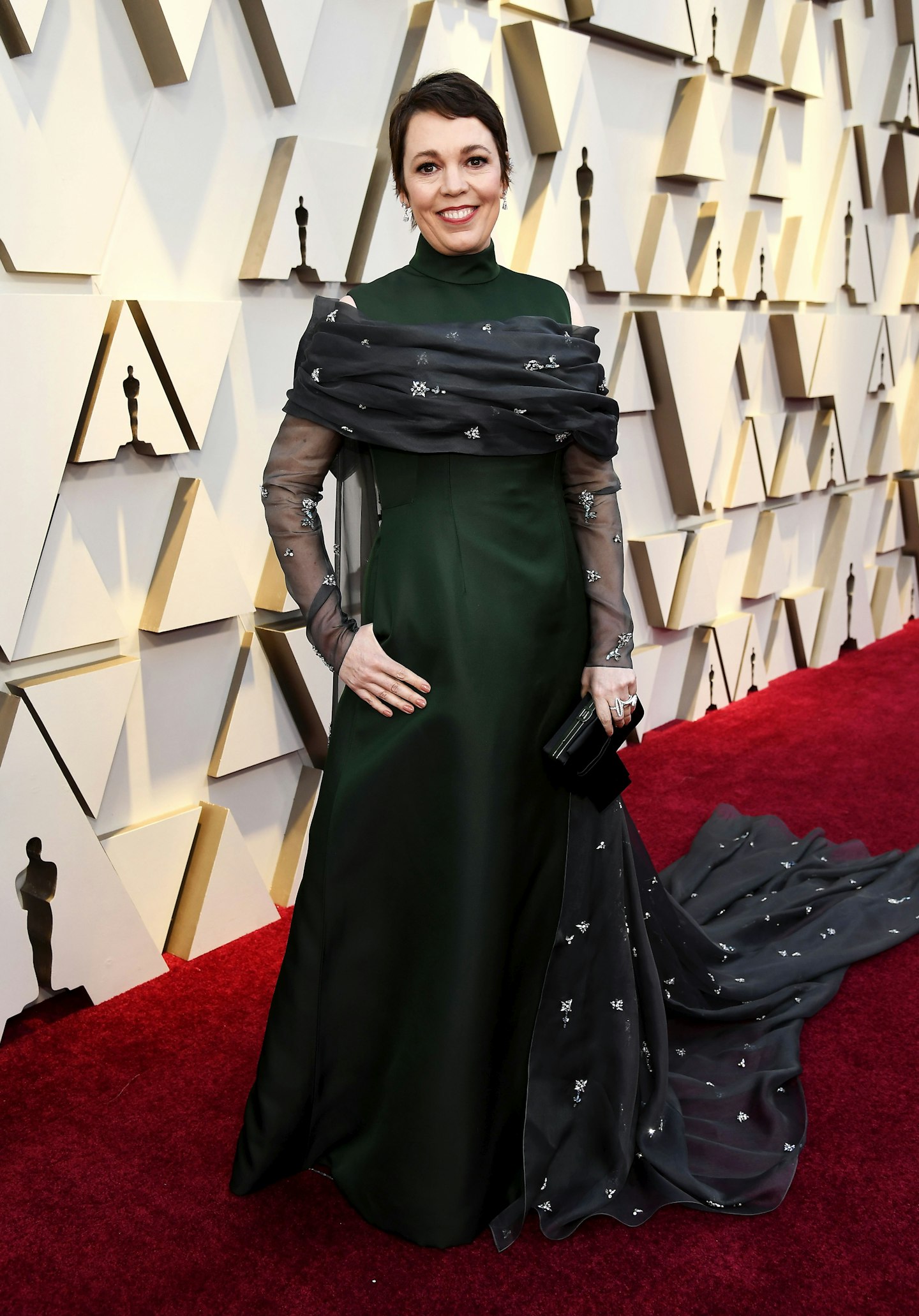 Olivia Colman wearing a high-necked gown from Prada