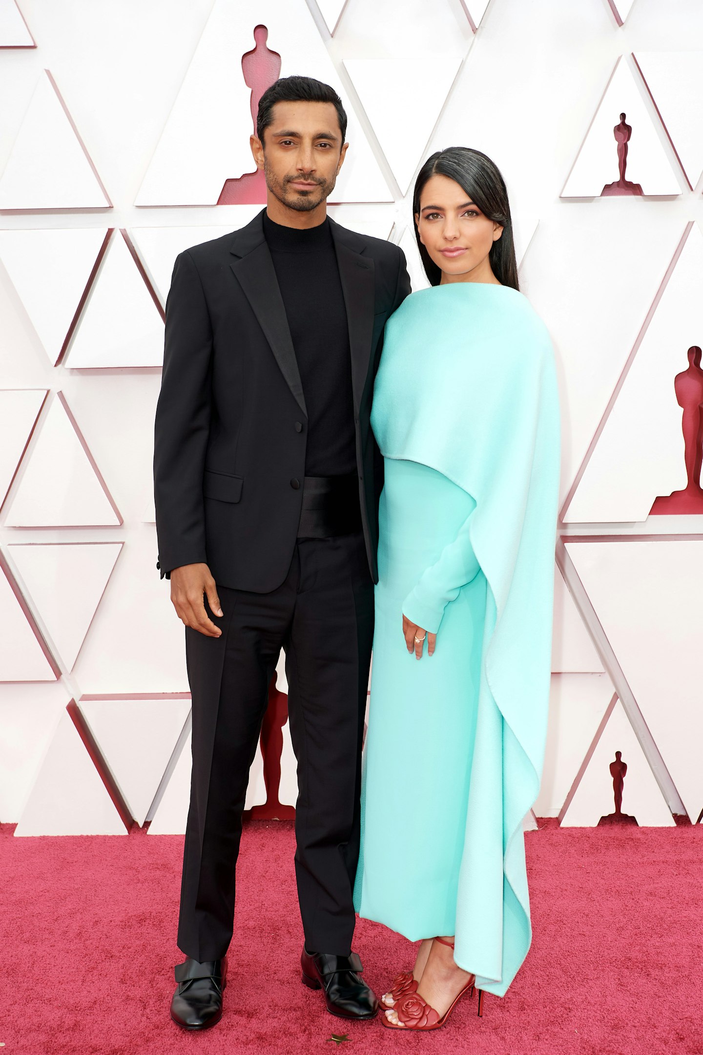 Riz Ahmed in Prada and Fatima Farheen Mirza in Valentino