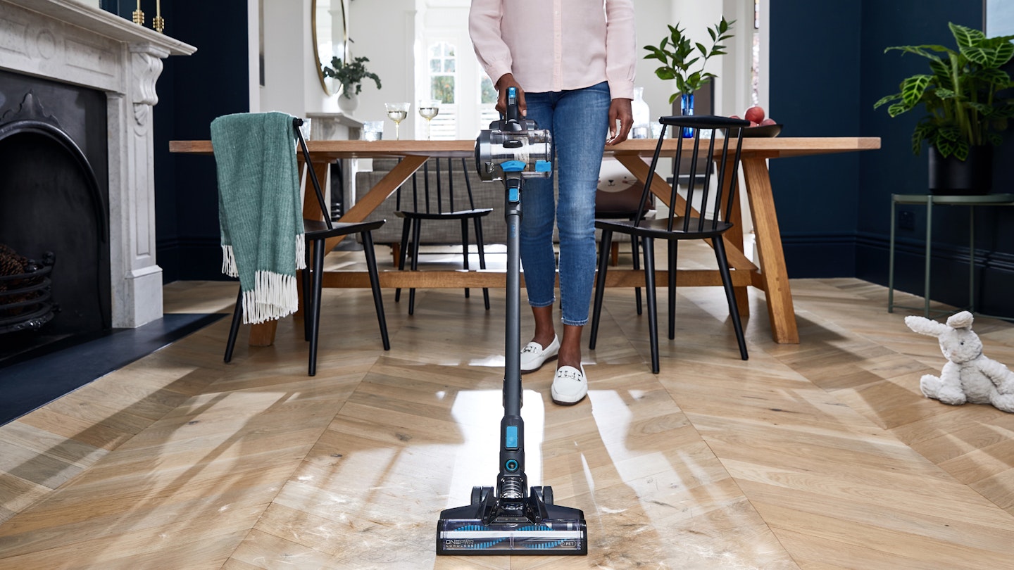 woman cleaning using Vax ONEPWR Blade 4 Pet Cordless Vacuum Cleaner