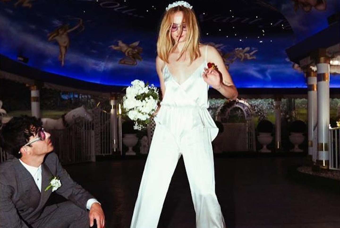 Sophie Turner wearing a white jumpsuit on her wedding day in Las Vegas 