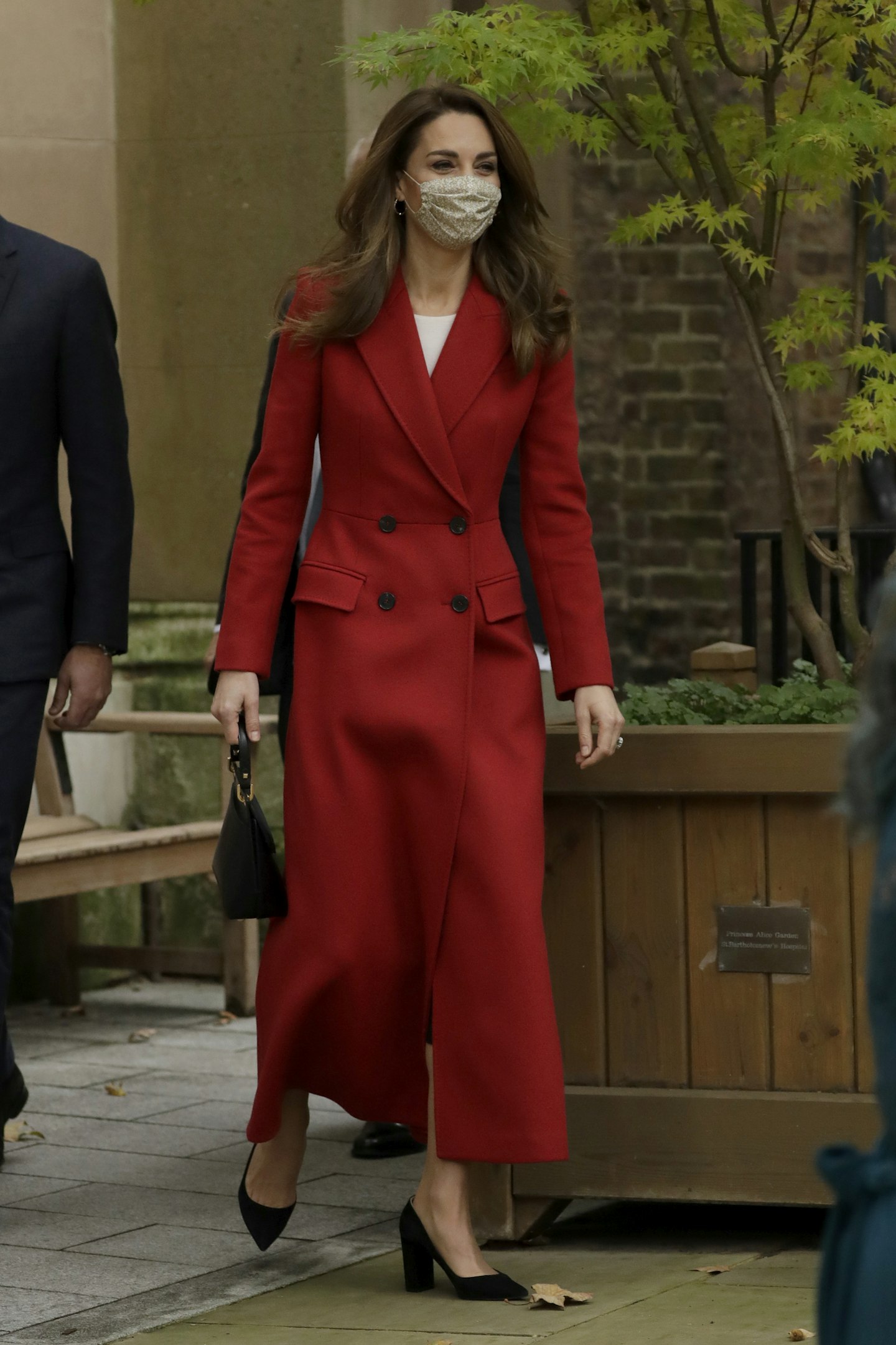 Kate Middleton wearing a red coat from Alexander McQueen