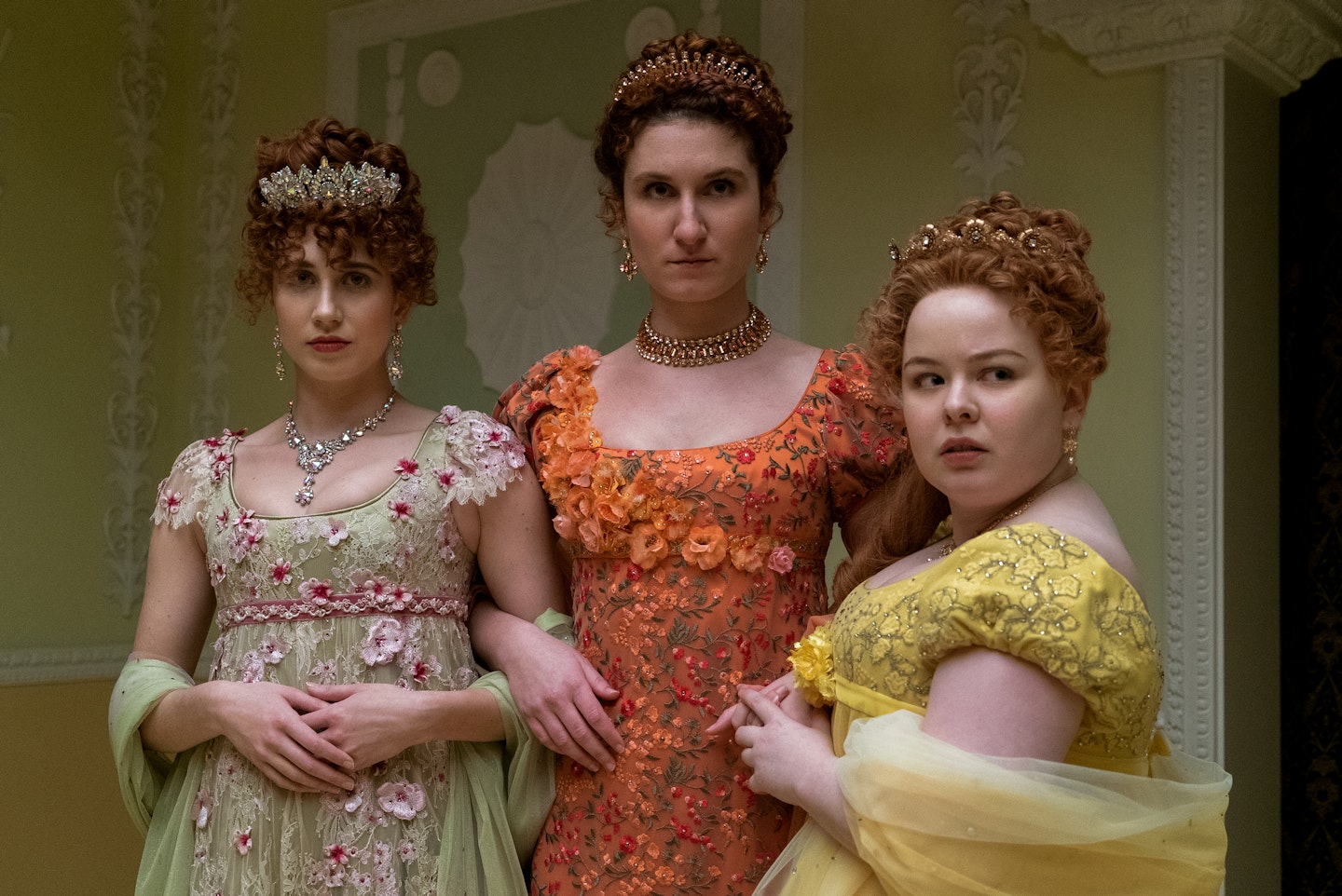 The Featherington Sisters wearing empire-line dresses in Bridgerton