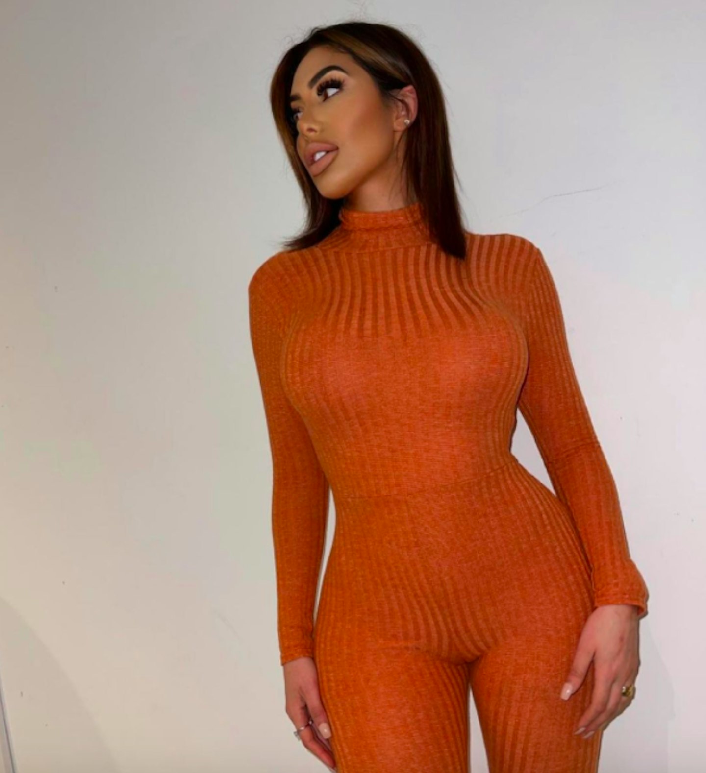 Chloe Ferry battles to stop her boobs popping out as she is caught