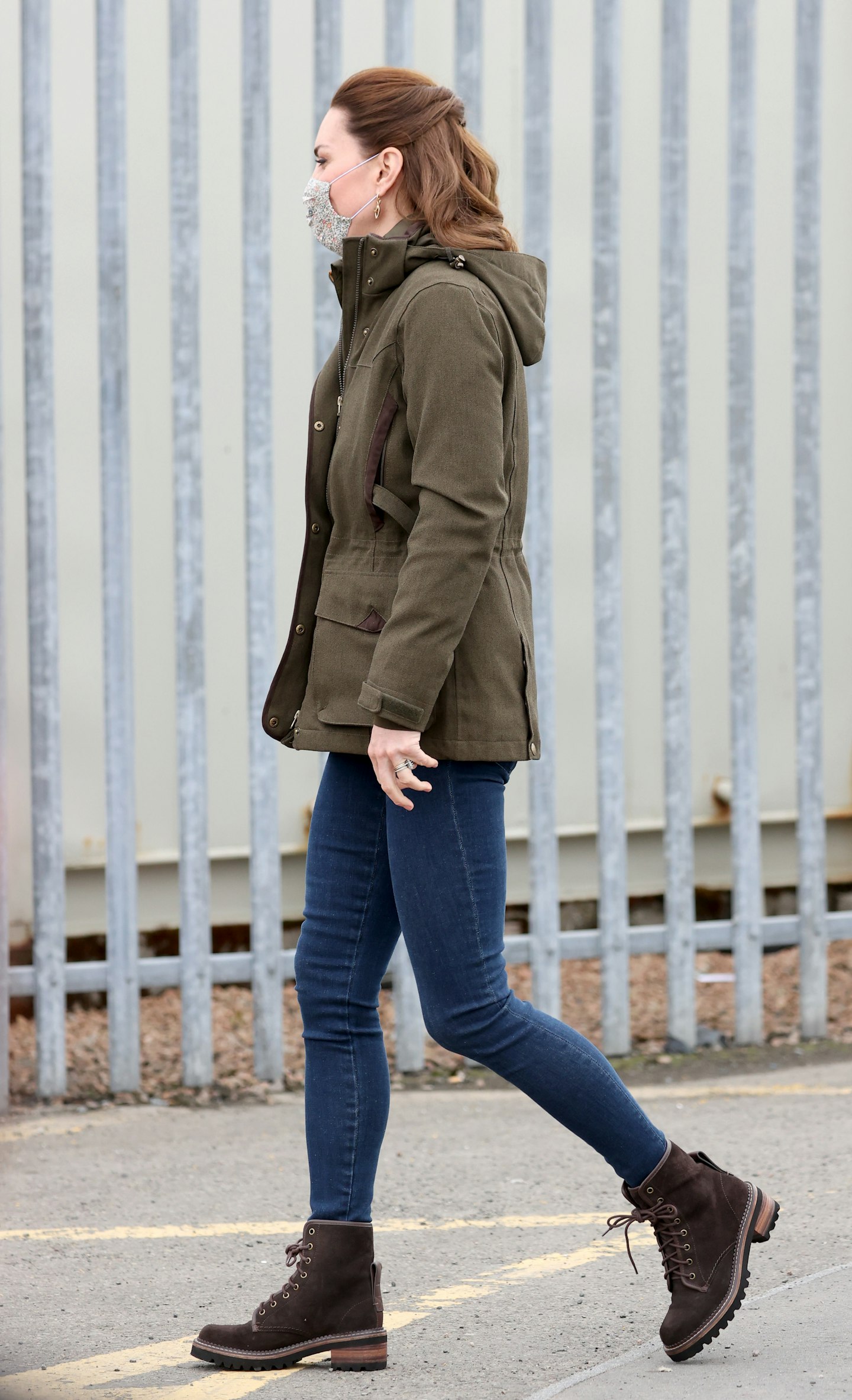Kate Middleton wearing walking boots and a khaki jacket 