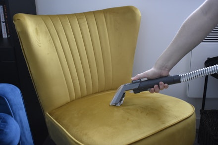 The Vax SpotWash in action on a chair