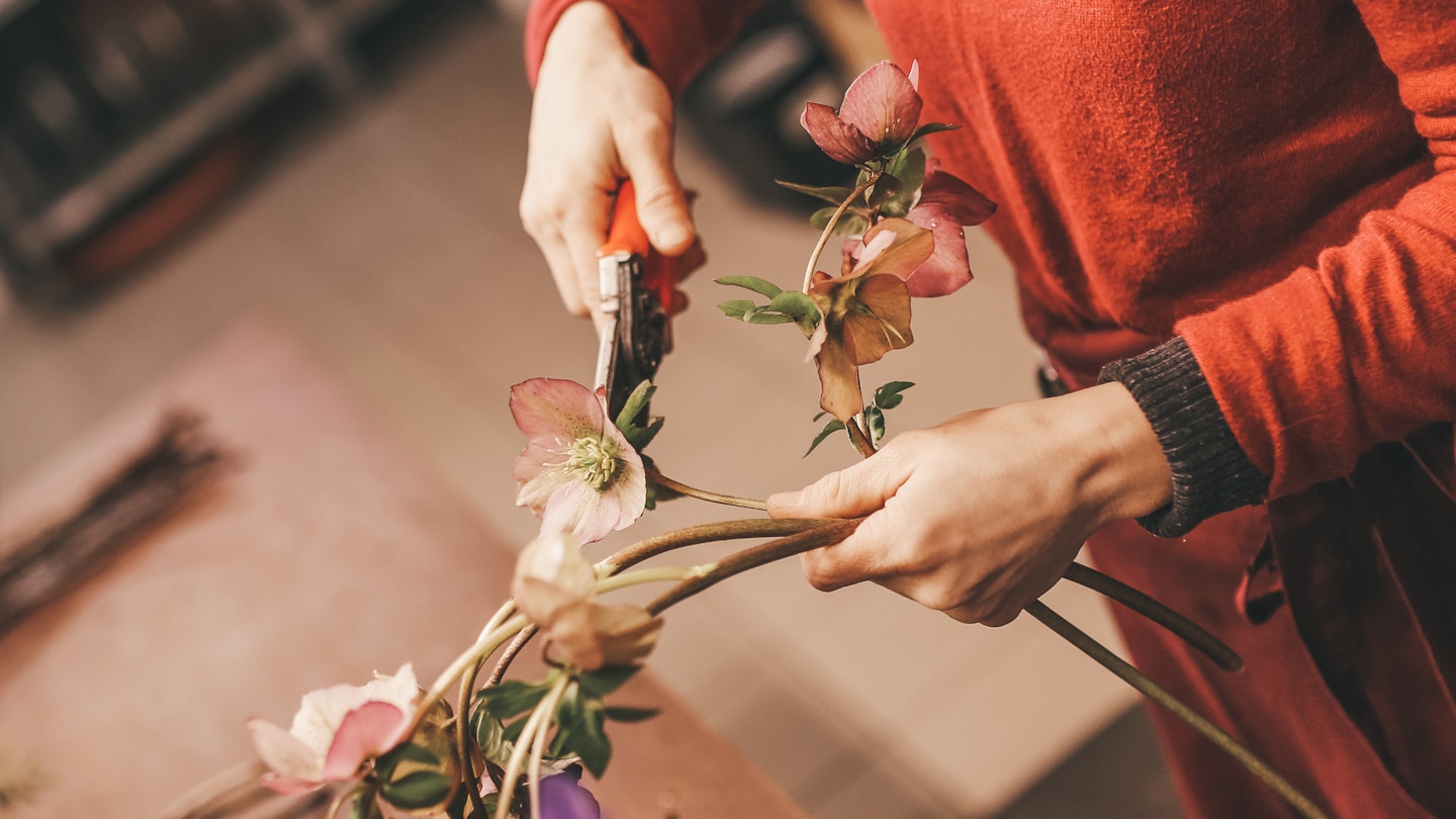 getty images woman flower arranging - flower arrangement courses 