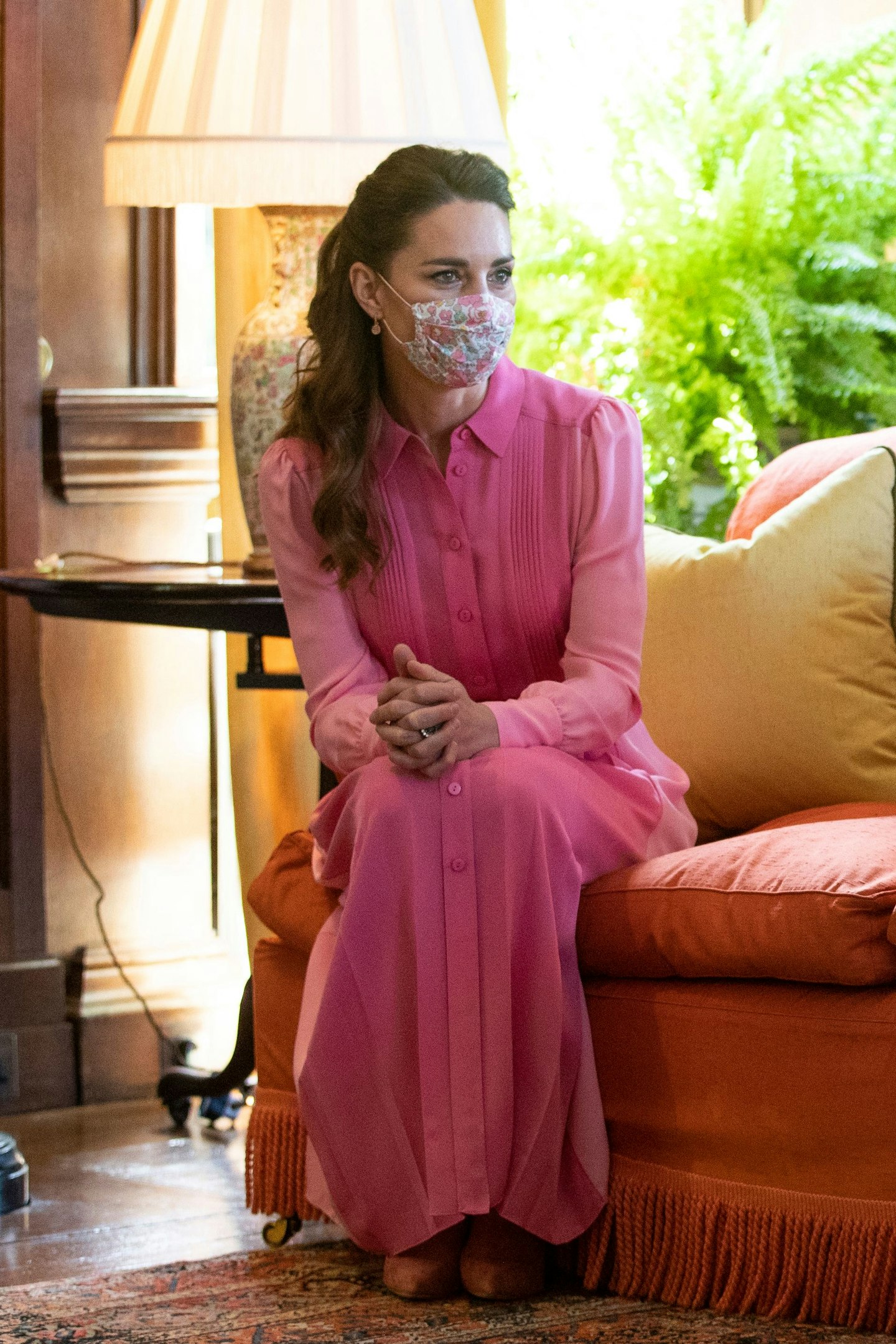 Kate Middleton wearing a pink shirt dress 