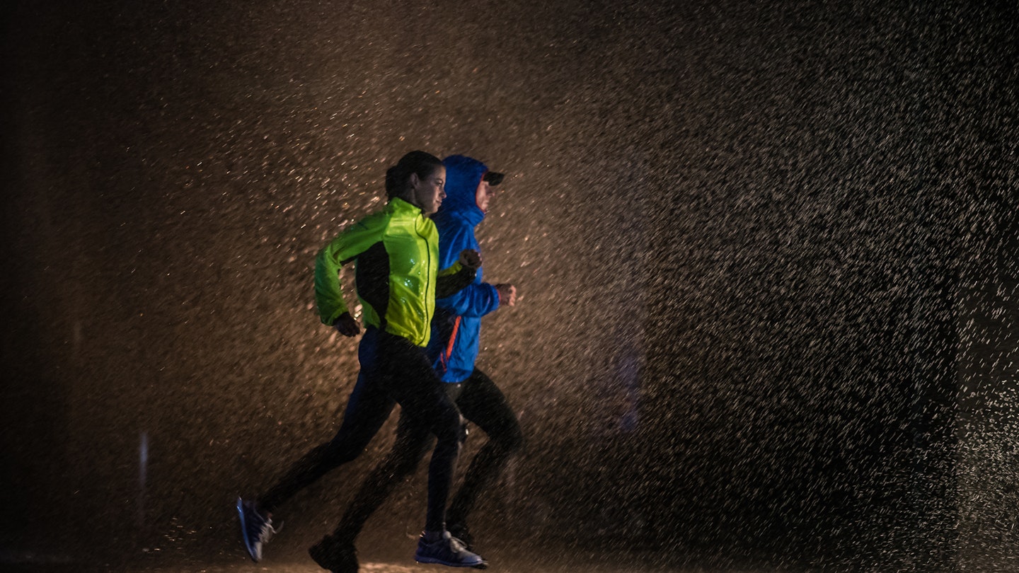 Joggers running in the rain