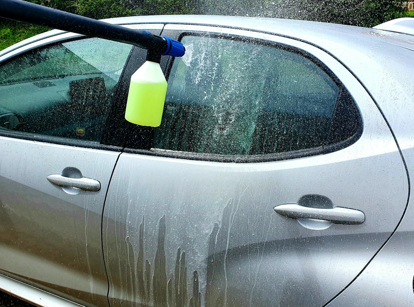 Nilfisk foaming spray bottle and car