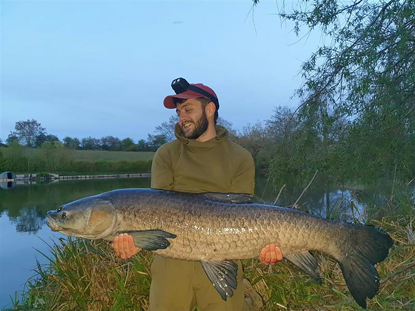 Sam Hamill shows off the 45lb 8oz Big Blue carp