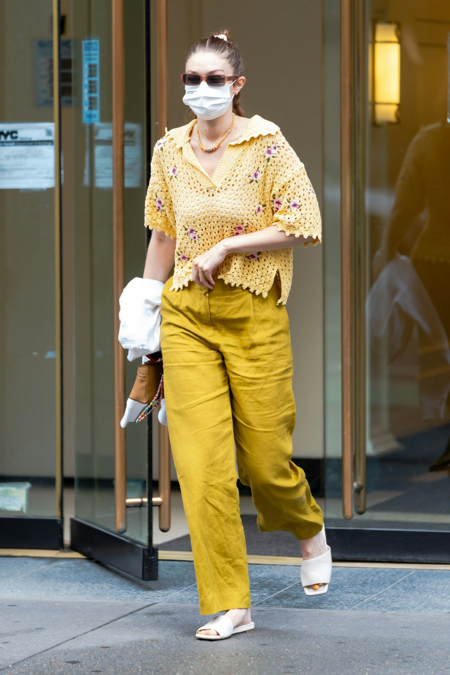 Gigi Hadid wearing a crocheted polo shirt from Mango