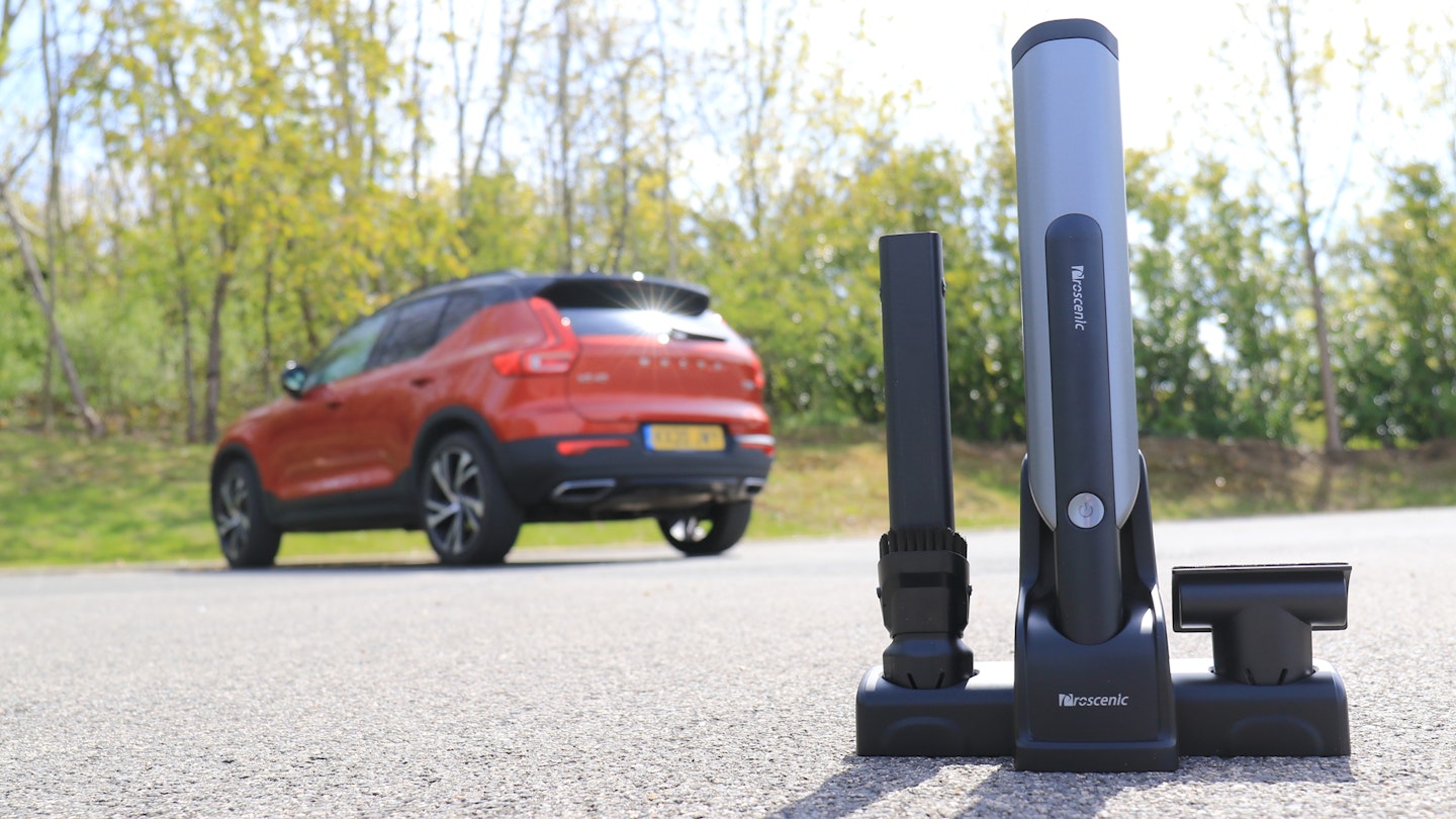 The Proscenic S1 handheld vacuum cleaner and a Volvo XC40