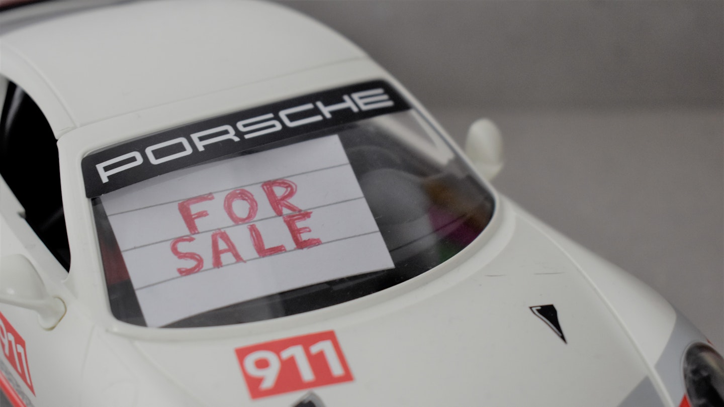 For Sale sign in a toy car 