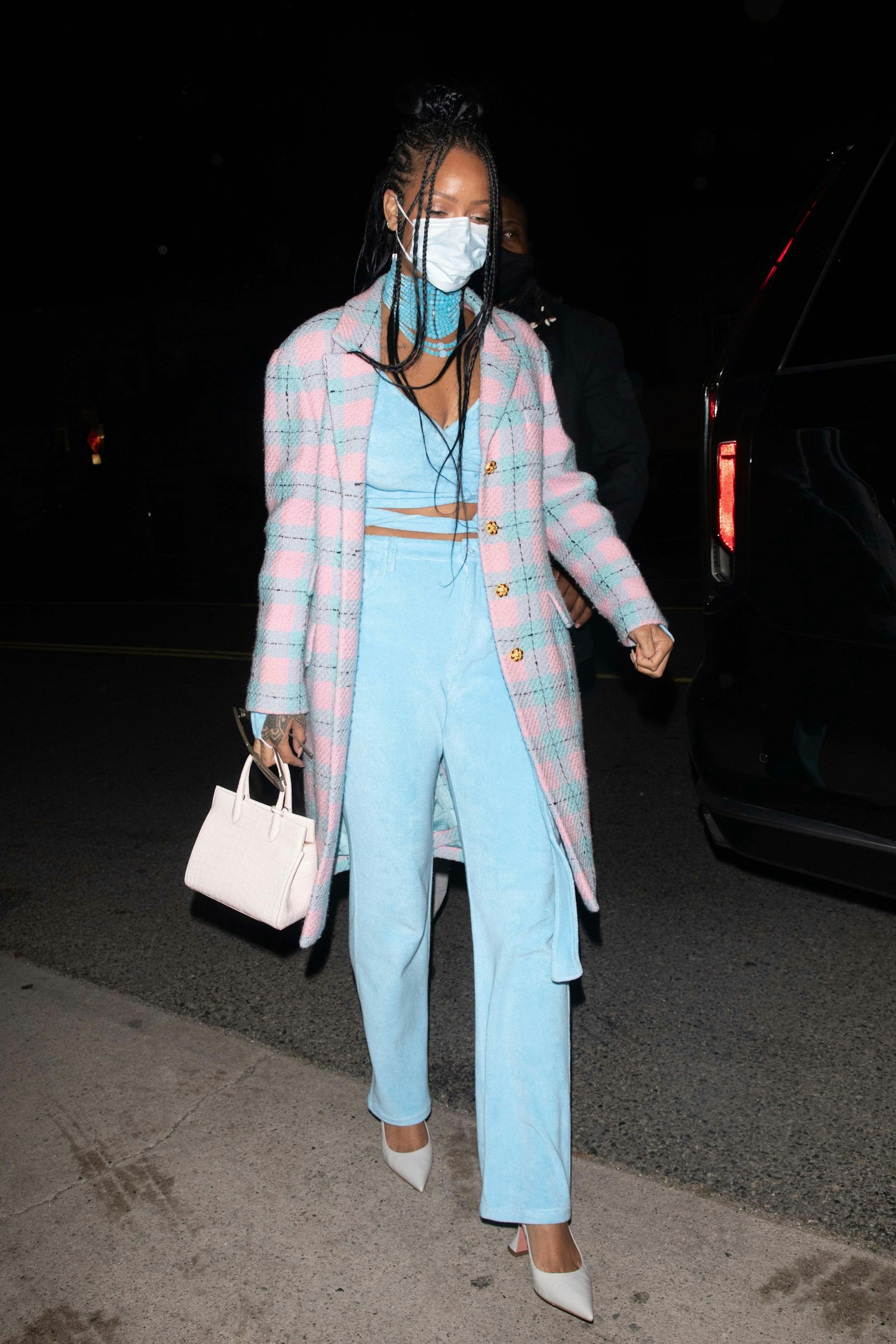 Rihanna wearing a blue and pink outfit