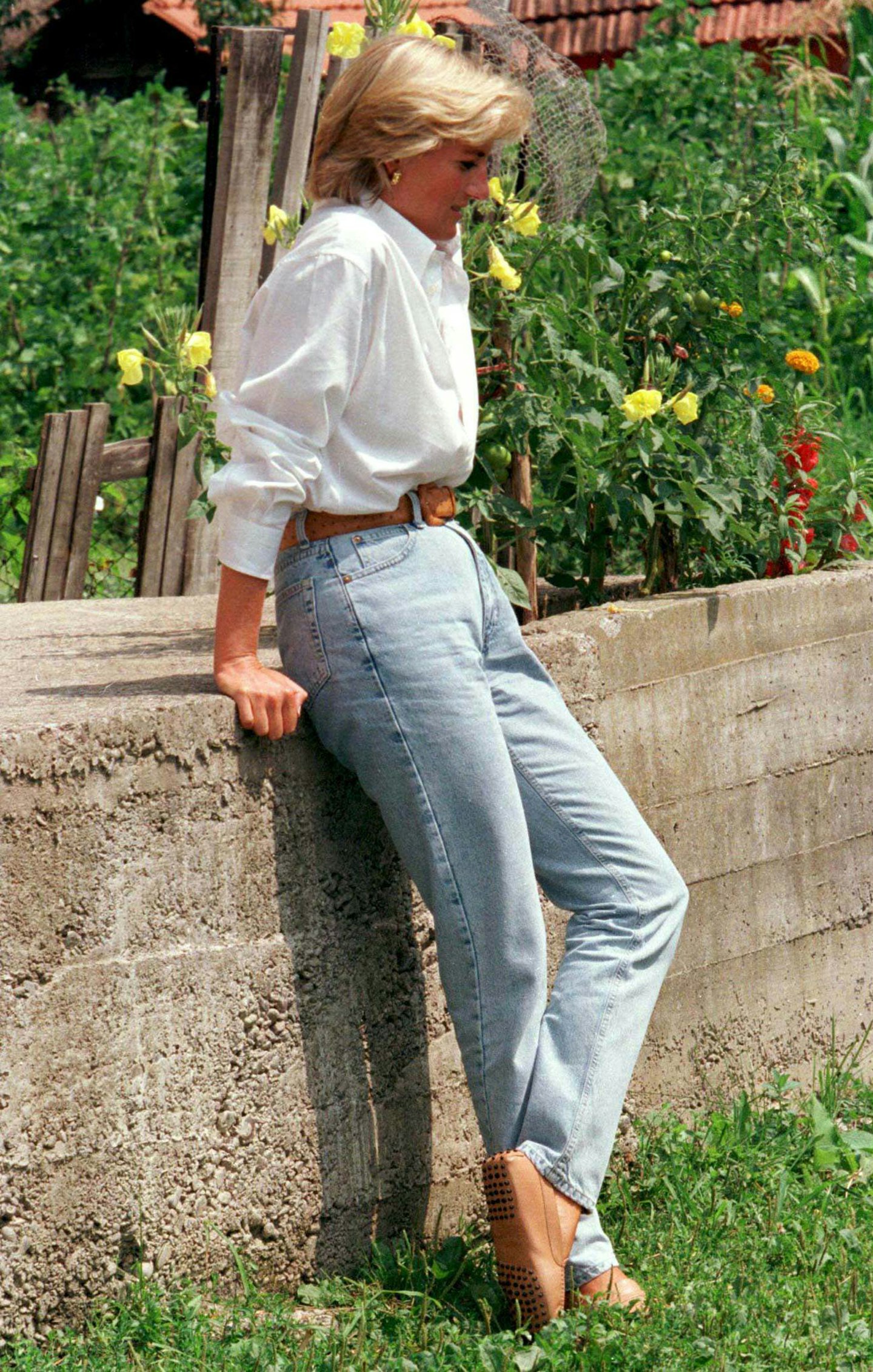 Princess Diana wearing a white shirt and jeans 