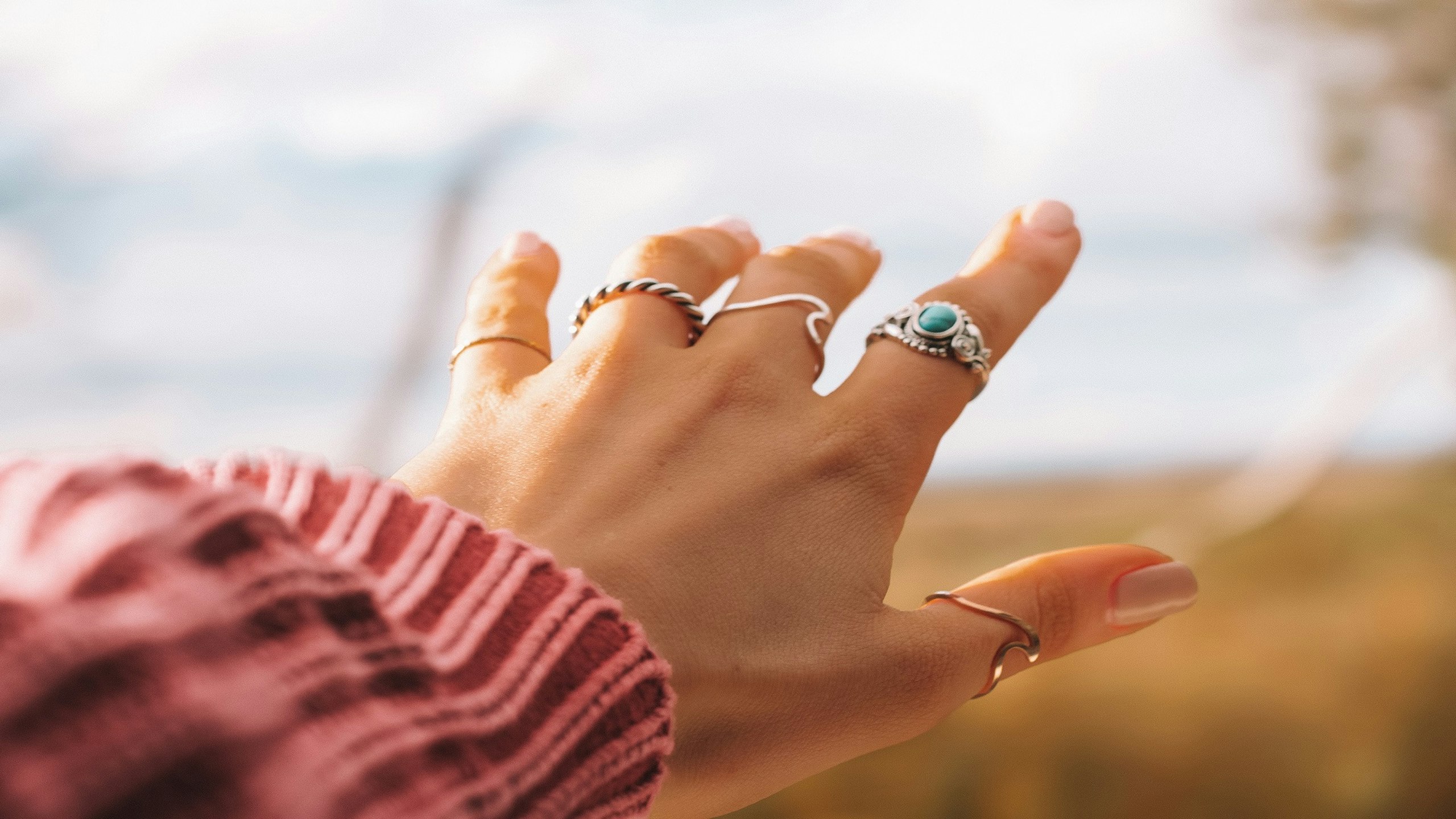 A stack of rings on a hand