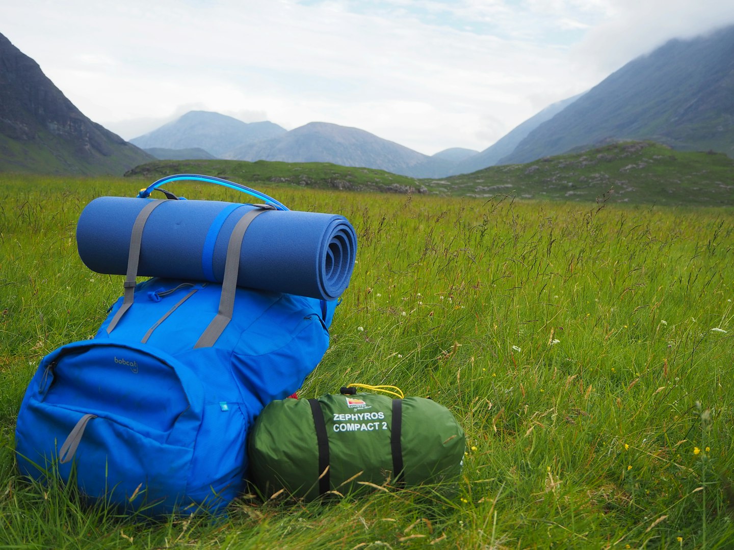 Wild Country Zephyros Compact 2 packed up next to a hiking pack