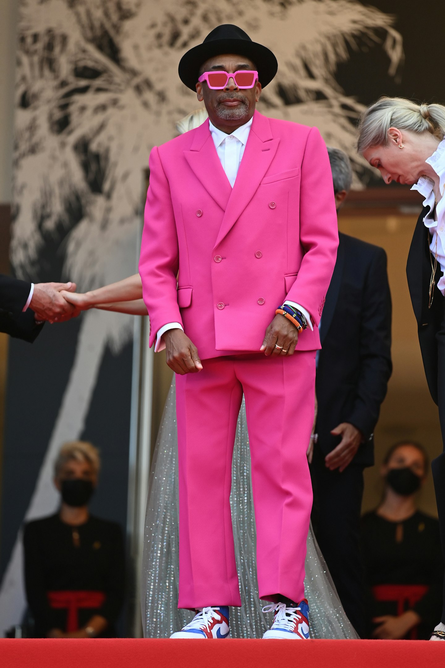 Spike Lee in a fuchsia Louis Vuitton suit