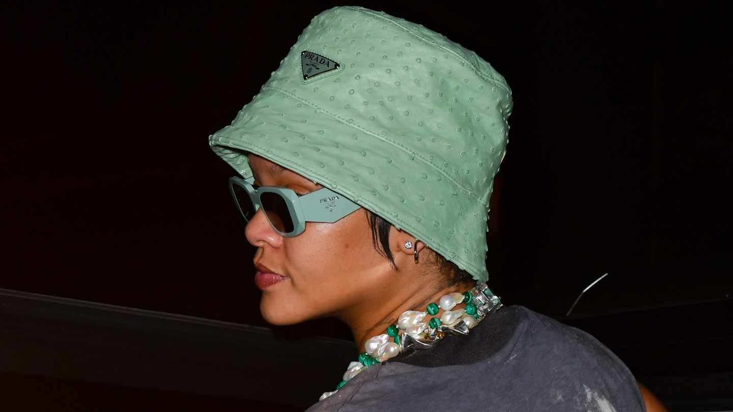 Rihanna wearing a mint green bucket hat from Prada